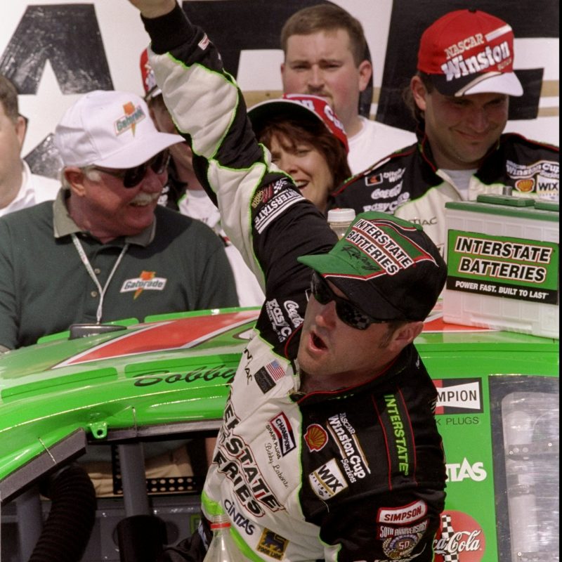 TALLADEGA, AL - APRIL 26:  Bobby Labonte driver of the #18 Interstate Batteries Pontiac Grand Prix celebrates in victory lane after winning the Diehard 500 on April 26, 1998 at the Talladega Superspeedway in Talladega, Alabama.  (Photo by David Taylor/Getty Images)