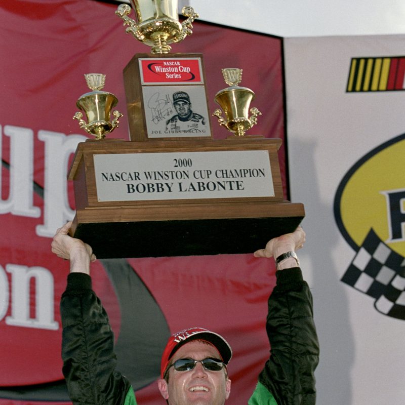 12 Nov 2000:   Driver Bobby Labonte #18 who drives a Pontiac Grand Prix for Joe Gibbs Racing holds up his winning Trophy after the Pennzoil 400, part of the NASCAR Winston Cup Series at the Homestead Miami Speedway in Homestead, Florida.Mandatory Credit: Donald Miralle  /Allsport