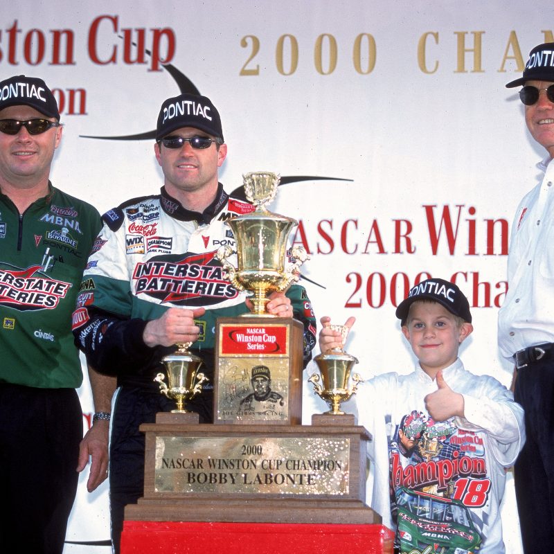 12 Nov 2000:  Driver Bobby Labonte #18 poses with Joe Gibbs after winning the Pennzoil 400, part of the NASCAR Winston Cup Series at the Homestead Miami Speedway in Homestead, Florida.Mandatory Credit: Donald Miralle  /Allsport